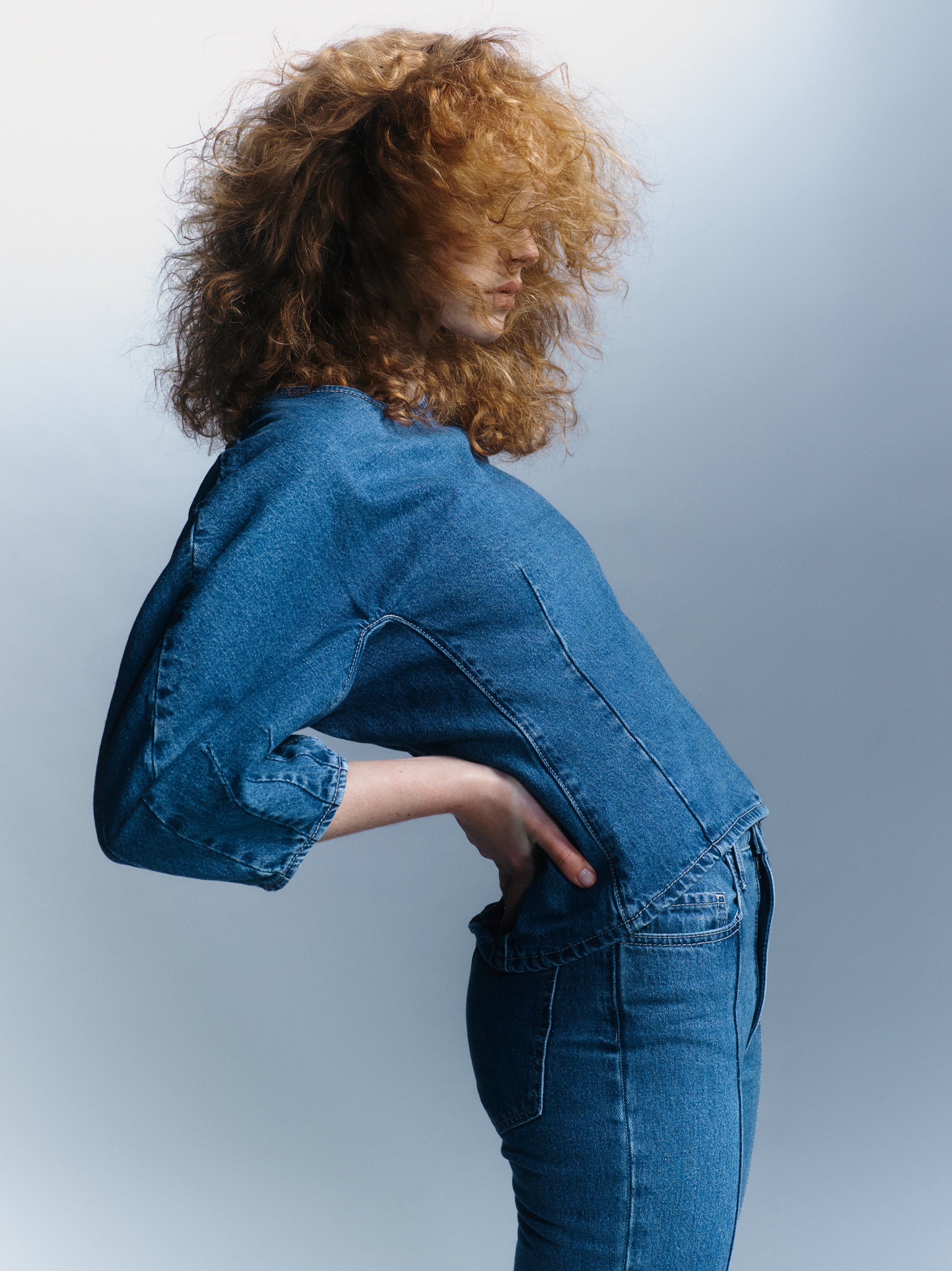 Model with red hair wears denim top and matching jean from Bianca Spender x Nobody Denim collaboration