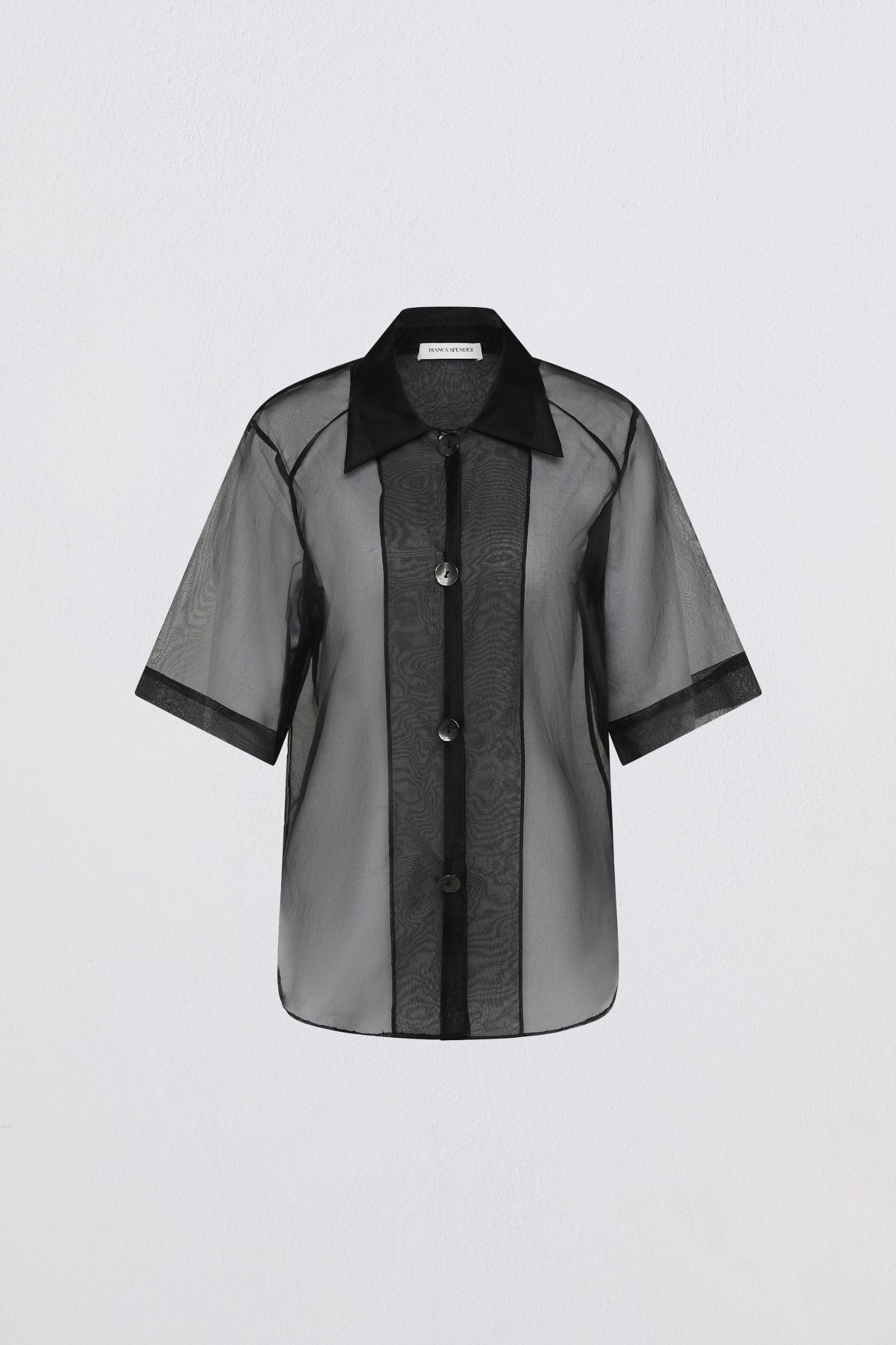 Sheer black and gray blouse with black collar on a light gray background
