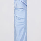 A light blue satin slip dress with thin black spaghetti straps, featuring a draped, gathered bodice and a flowing skirt, shown against a plain white background.