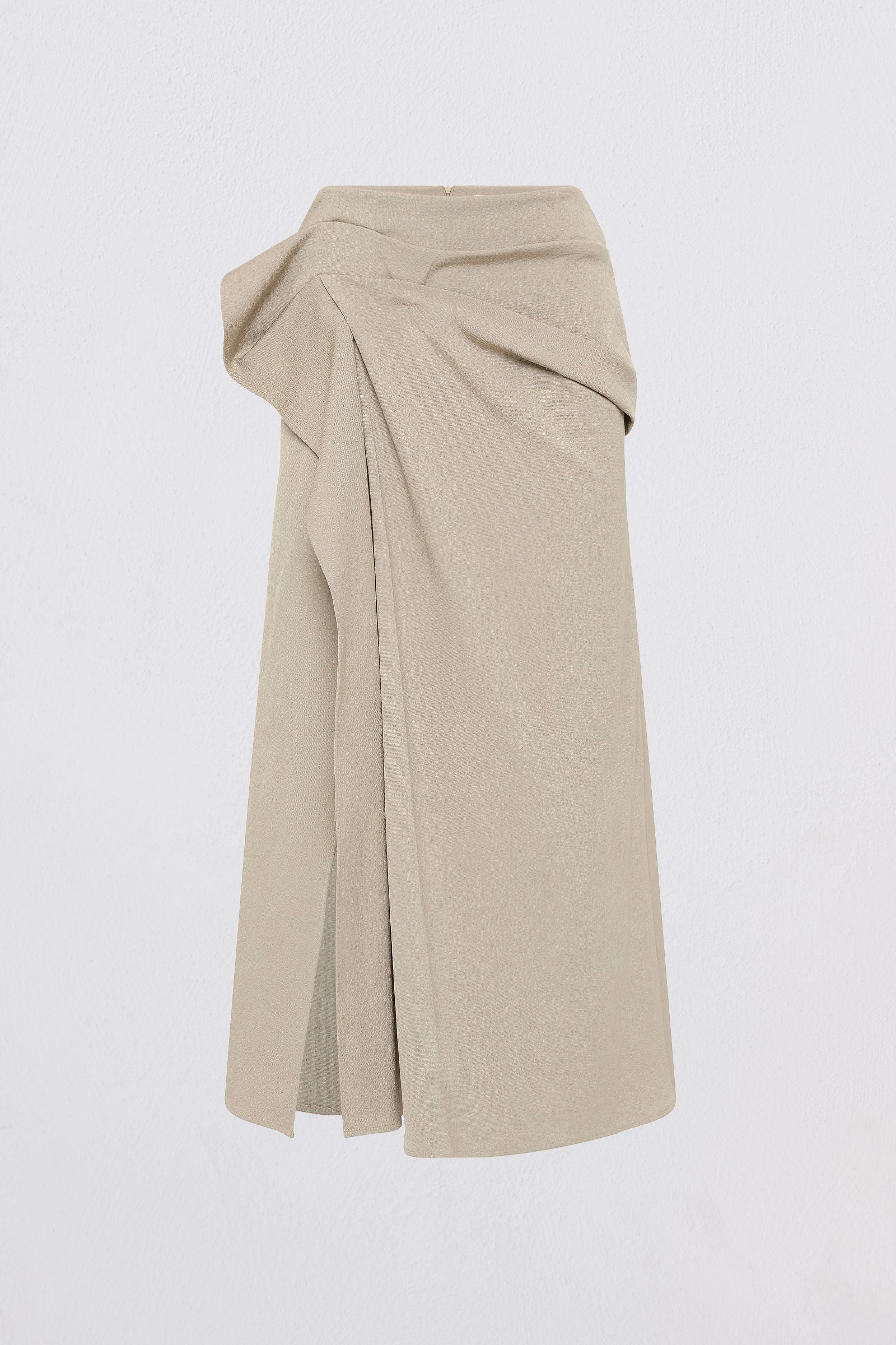 A light beige wrap-style midi skirt with a draped, gathered waist and front slit, shown against a plain white background.