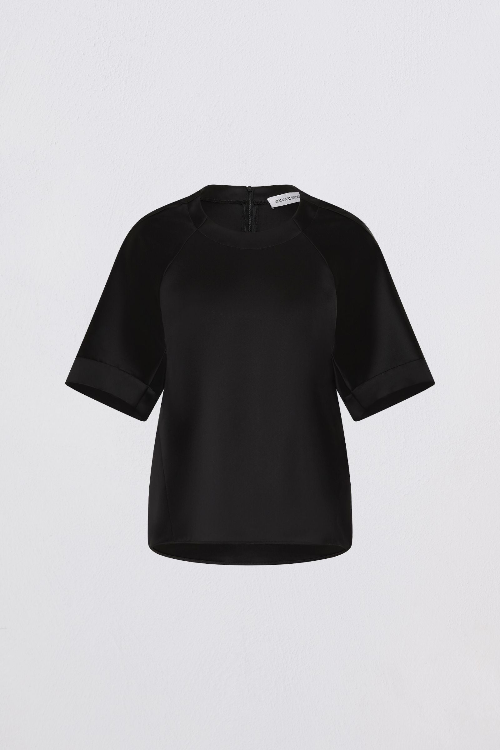 Black blouse on a light gray background