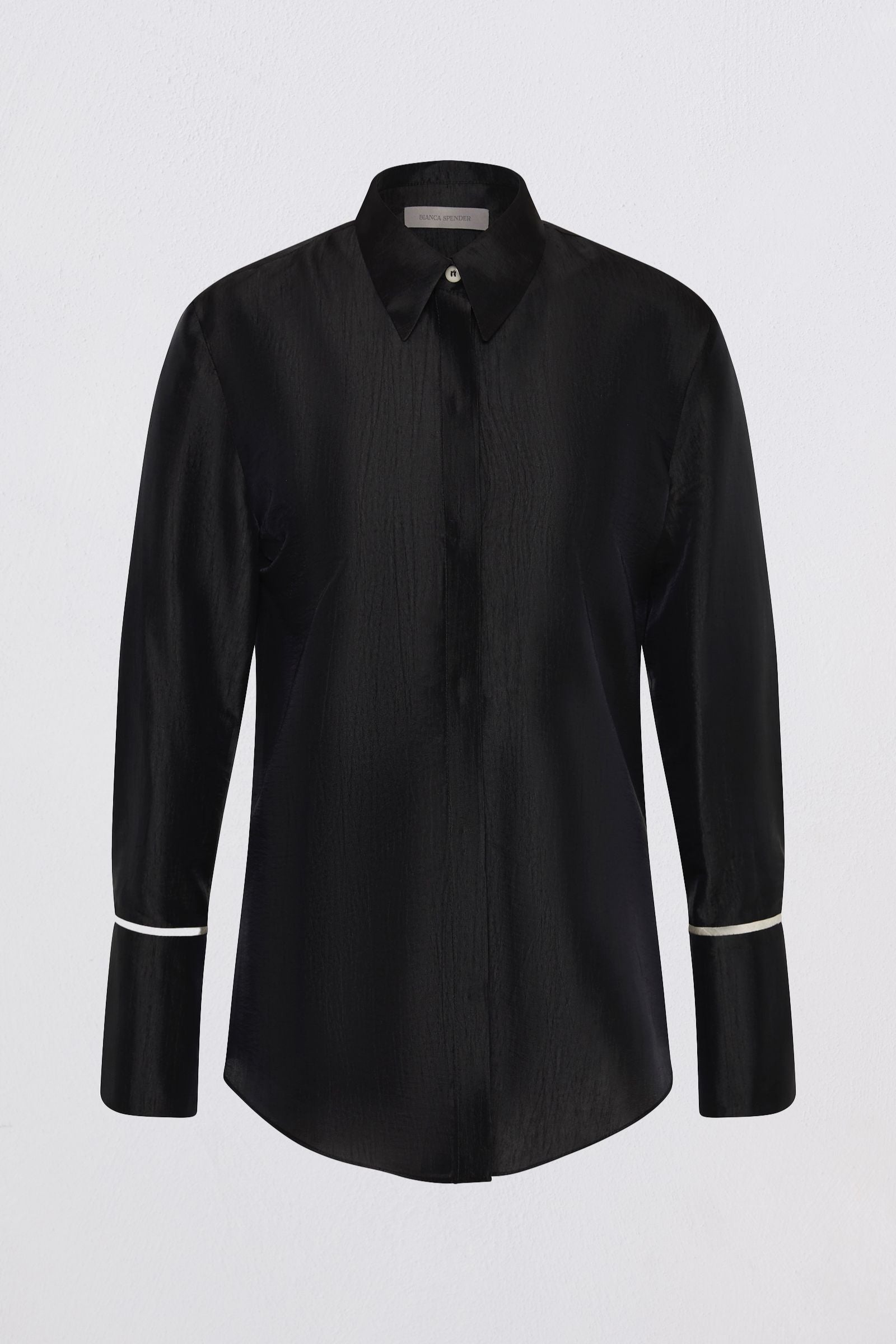 A black long-sleeve button-up shirt with a subtle vertical textured stripe pattern and contrasting white piping details on the cuffs, shown against a light gray background.