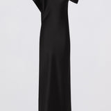 A black one-shoulder midi dress with a draped, asymmetrical neckline, shown on a plain light gray background.