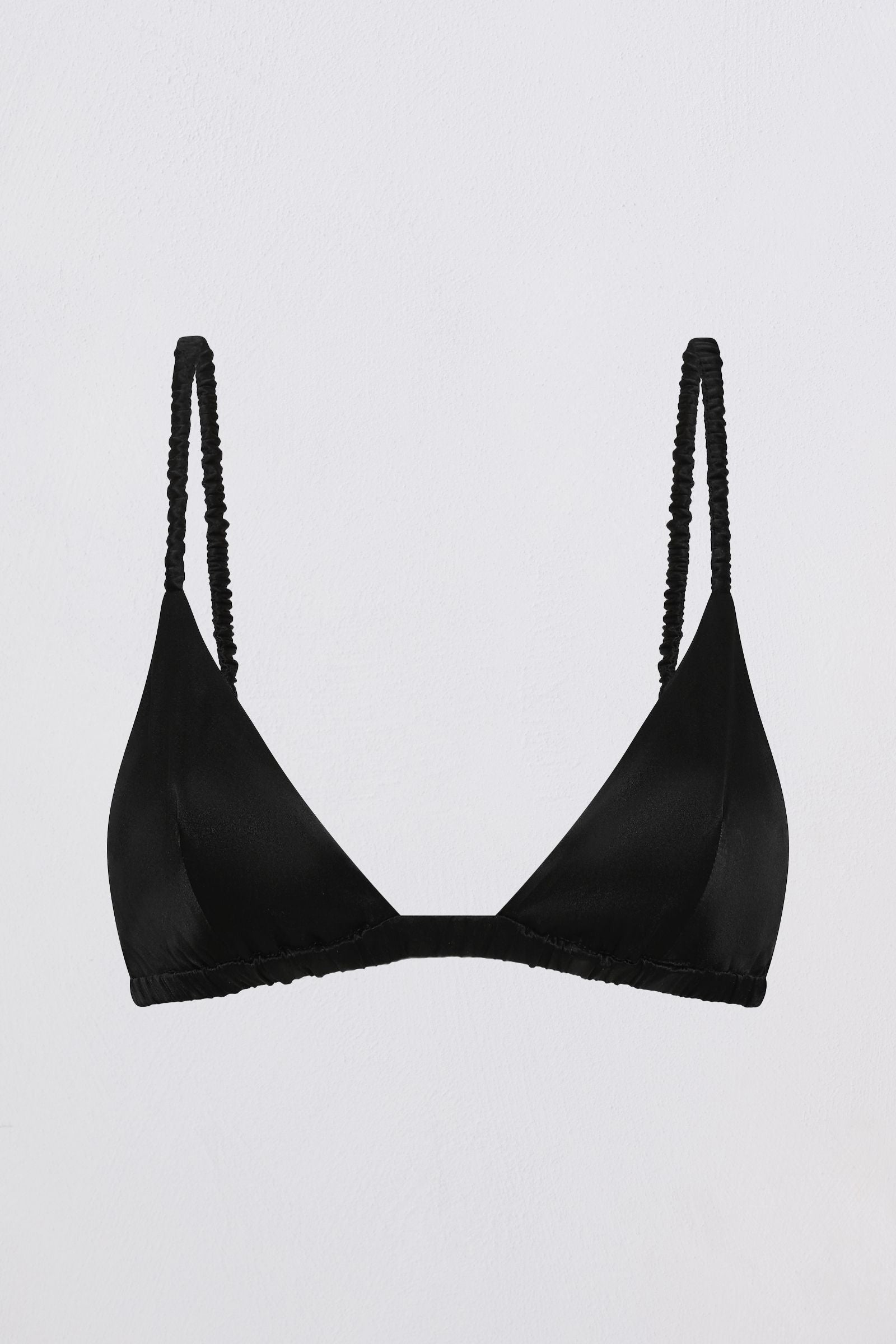A black triangle bralette with textured, fringed straps, displayed against a plain light gray background.