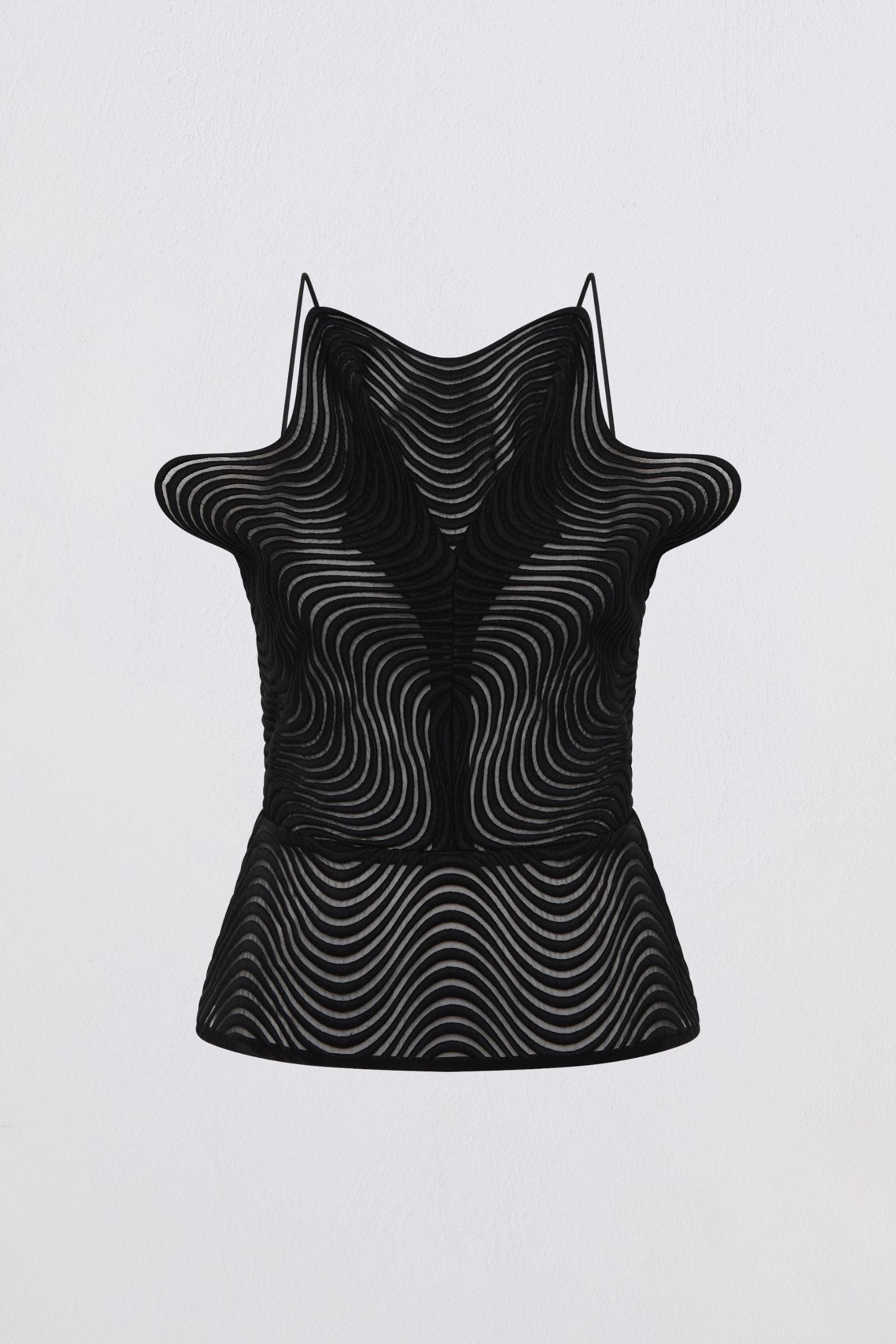 Black sleeveless top with a unique pattern on a light gray background