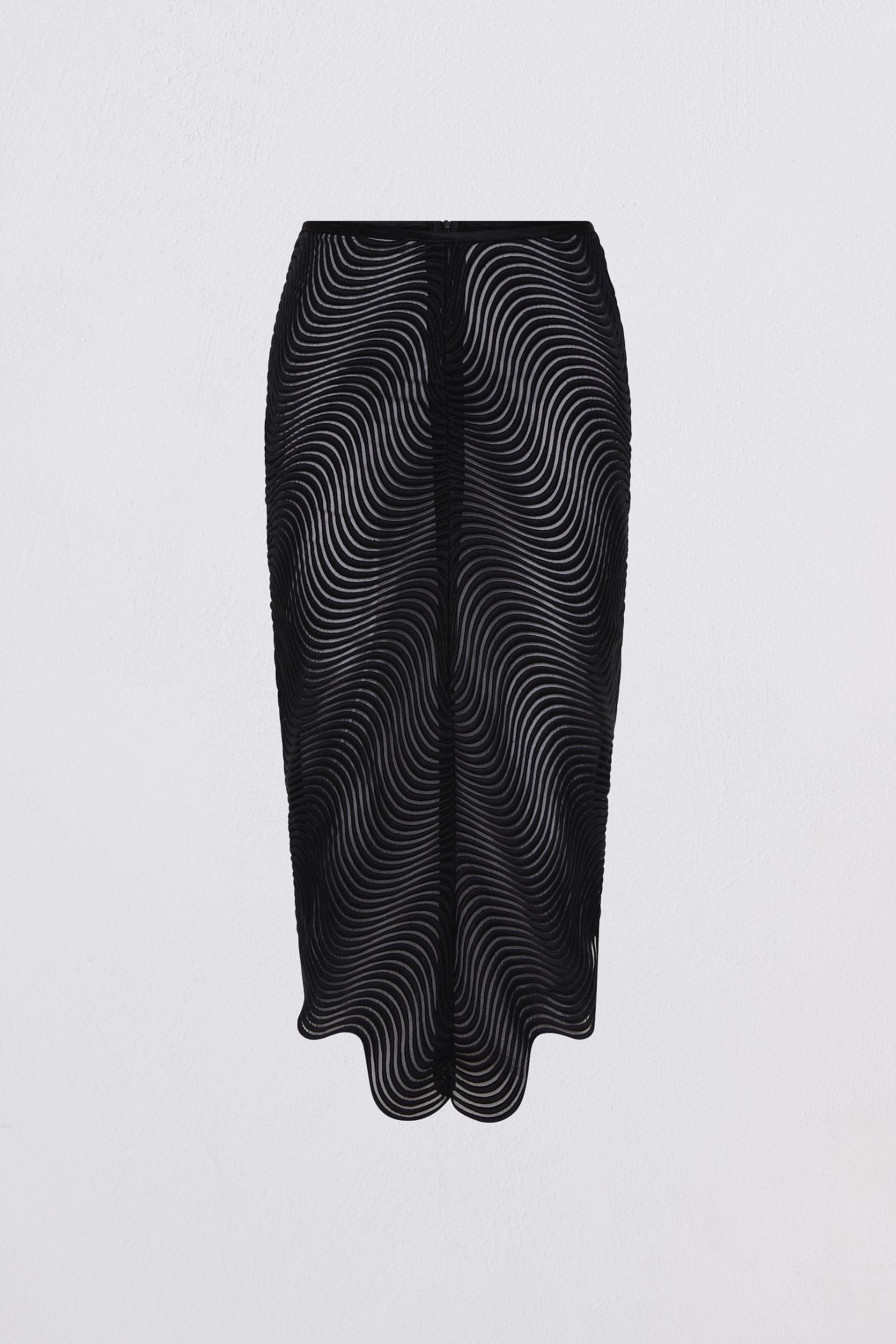 Black skirt with wavy pattern on a light gray background