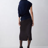 Woman wearing a dark blue outfit on a white background