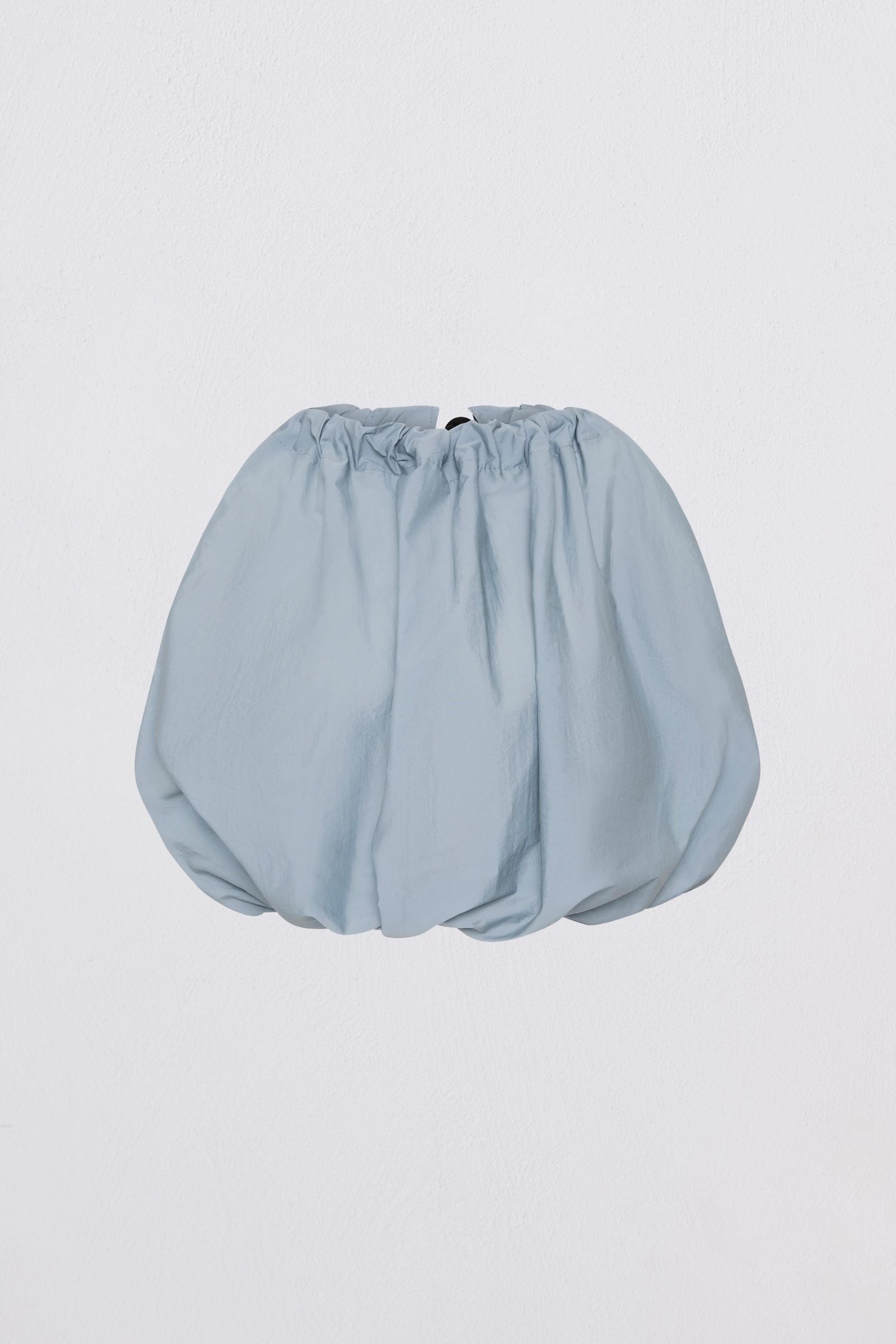 Blue top on light cray background