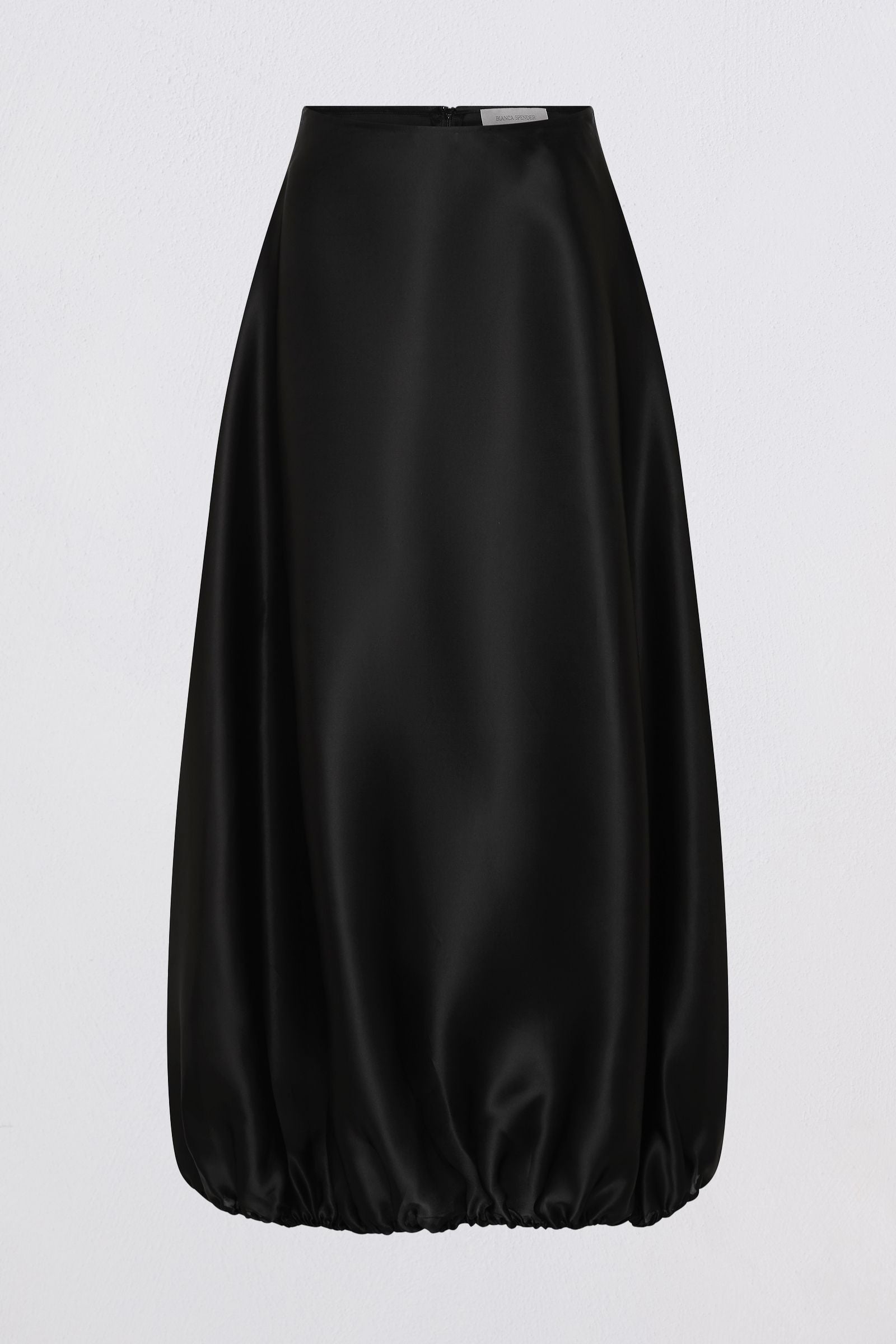 A black satin midi skirt with a gathered, balloon-like silhouette at the bottom, shown against a plain light gray background.