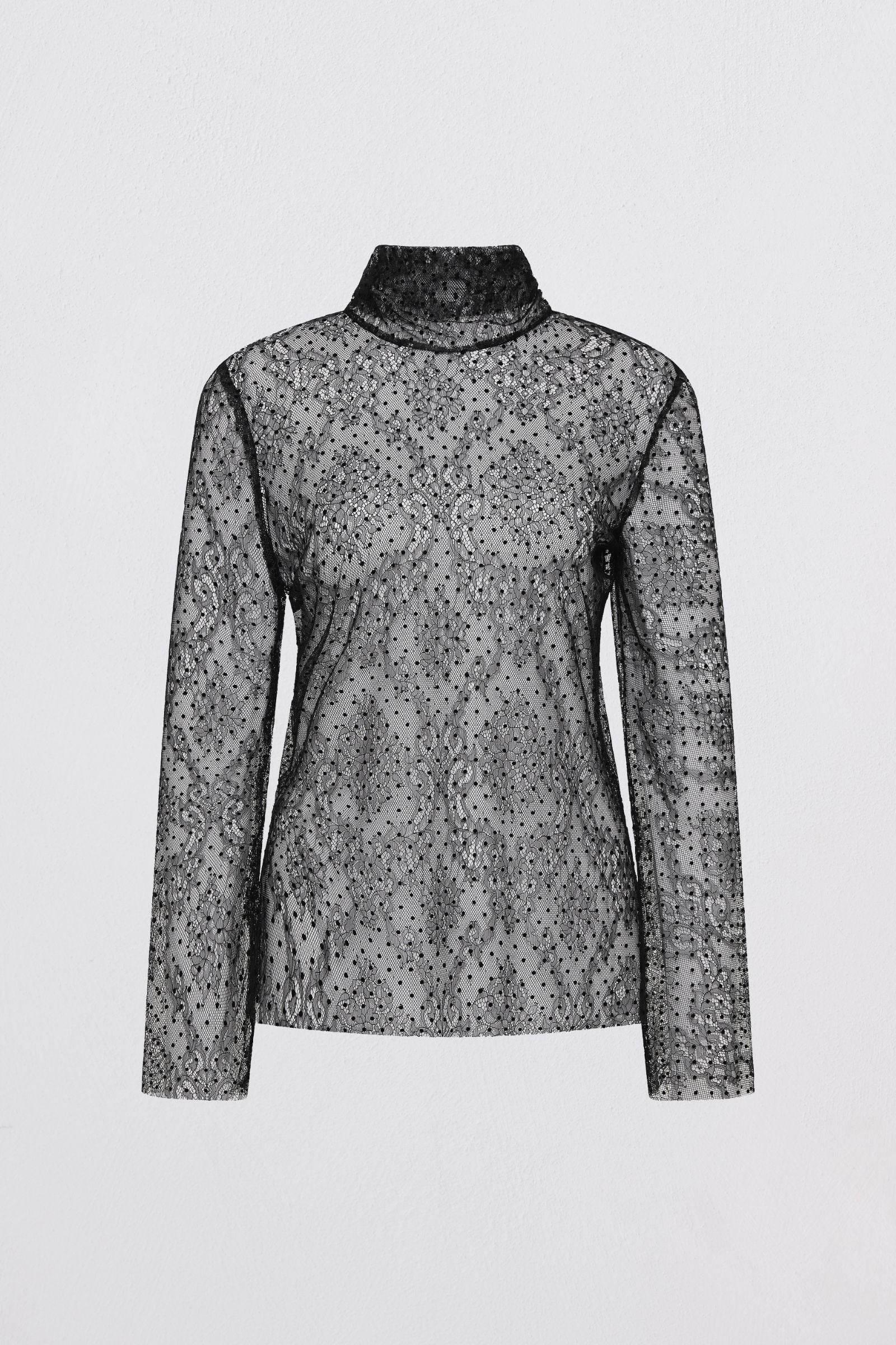 Sheer black floral blouse on a white background