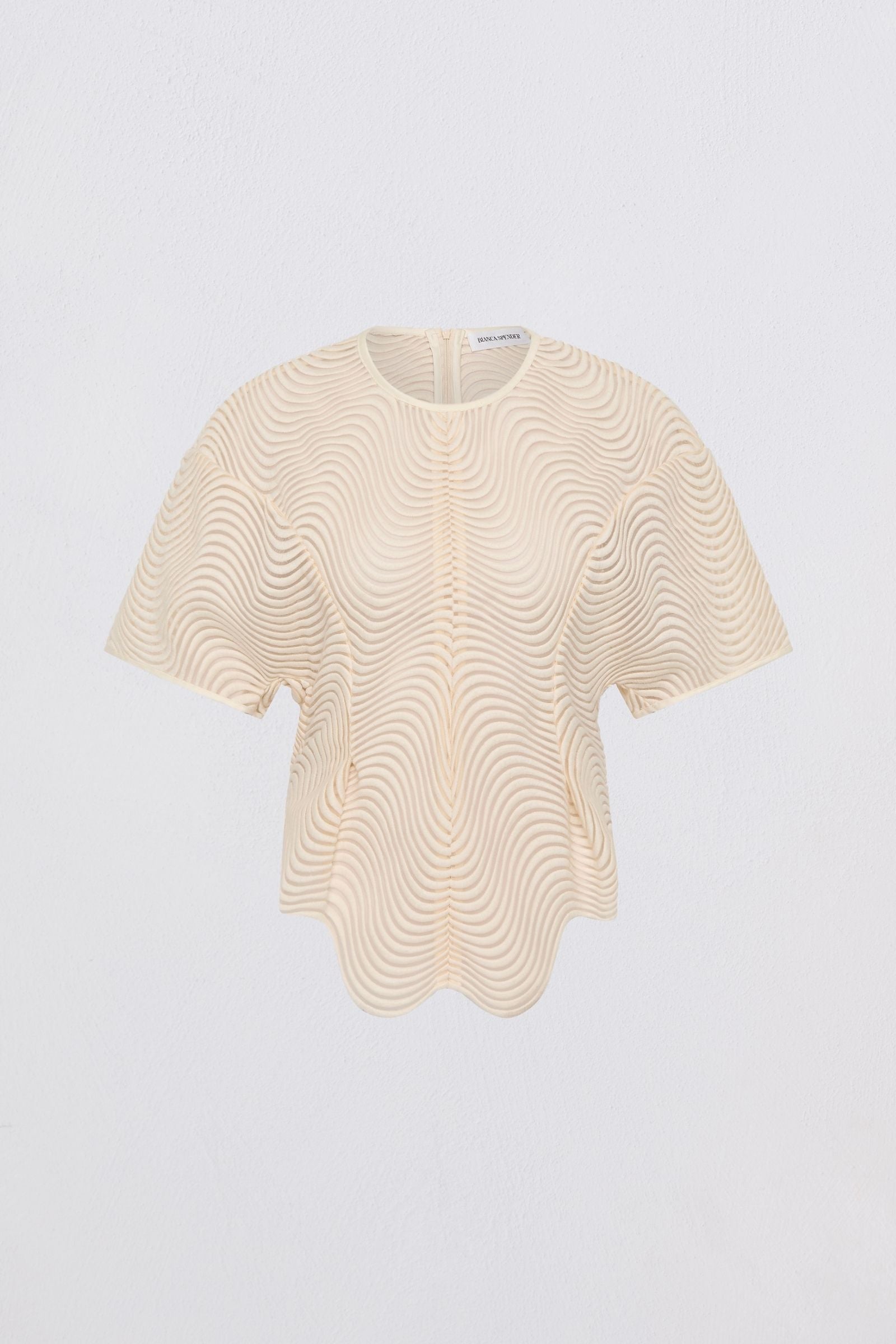 Beige lace top on a light gray background