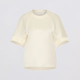 Cream t-shirt on a light gray background