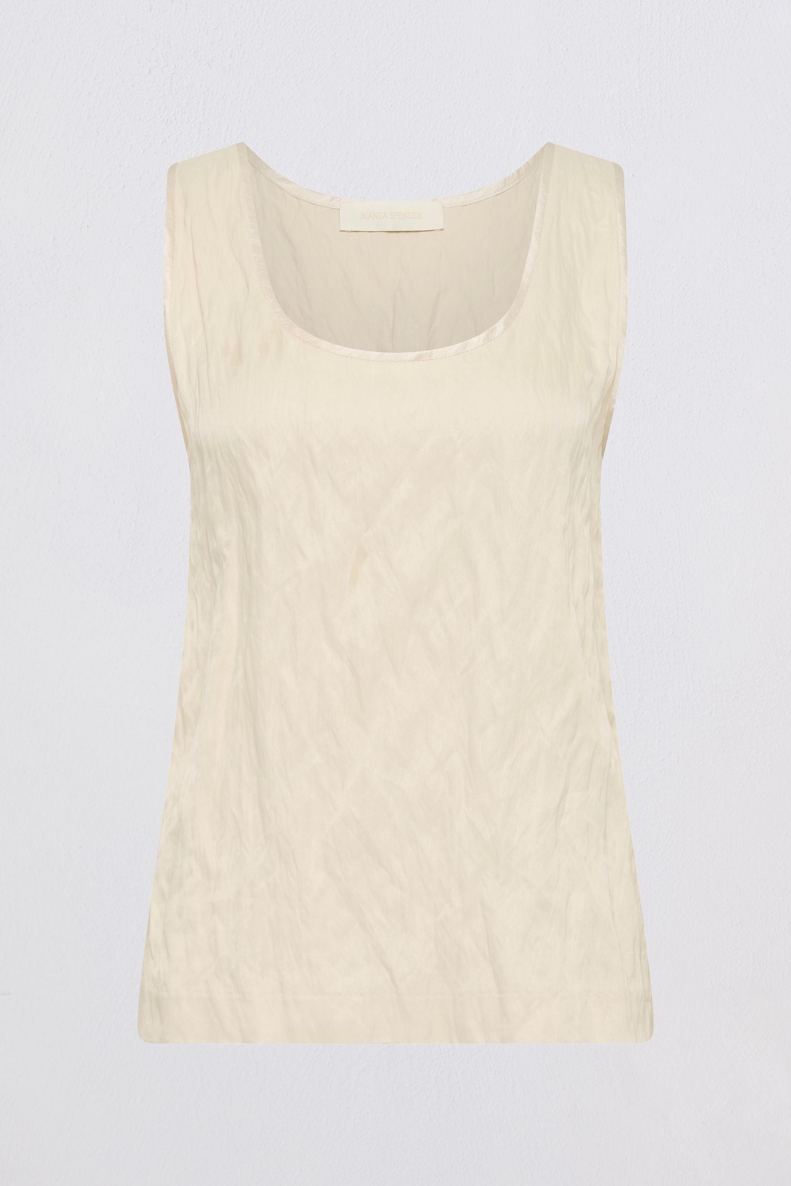 A sleeveless scoop-neck top in a light cream or off-white color, shown flat against a light gray background.