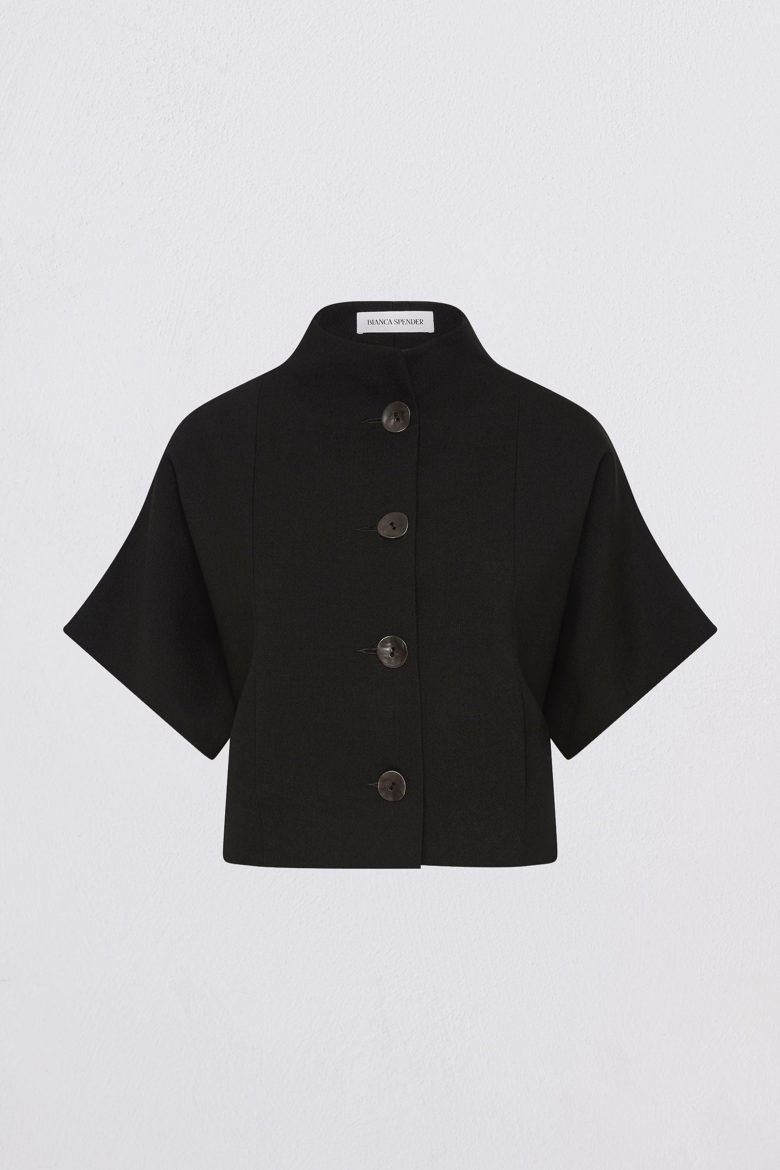 Black short-sleeve jacket with buttons on a light gray background