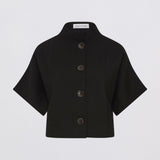 Black short-sleeve jacket with buttons on a light gray background
