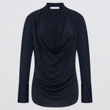Navy blue long-sleeve top with draped design on a light gray background