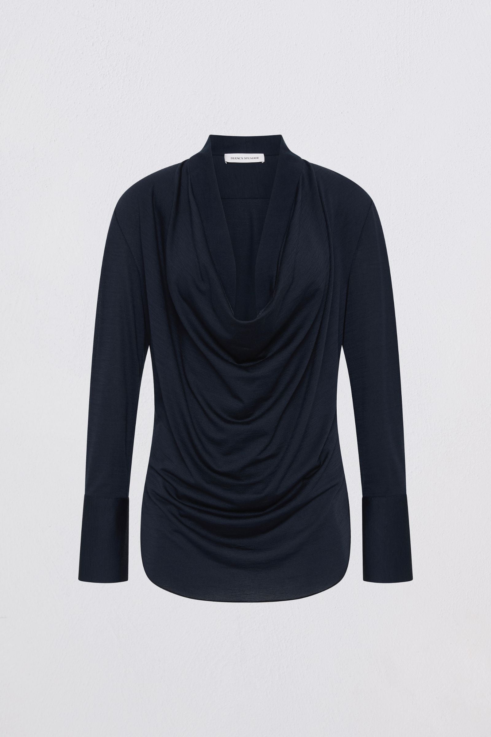 Navy blue long-sleeve top with draped design on a light gray background