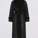Black trench coat with a subtle pattern on a light gray background