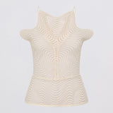 Beige sleeveless top with textured pattern on a light gray background