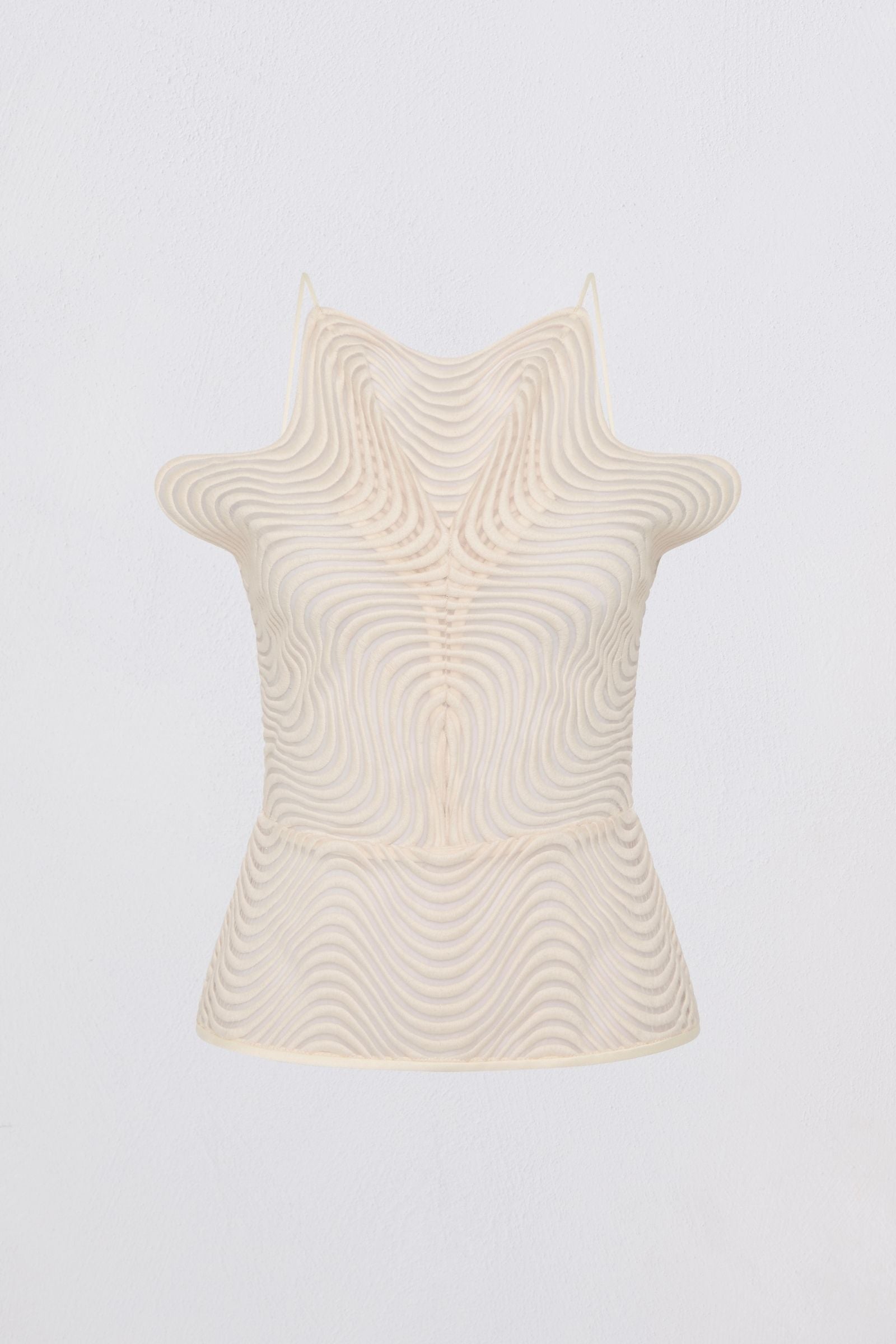 Beige sleeveless top with textured pattern on a light gray background