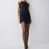 Black sleeveless dress with wavy pattern on a plain background