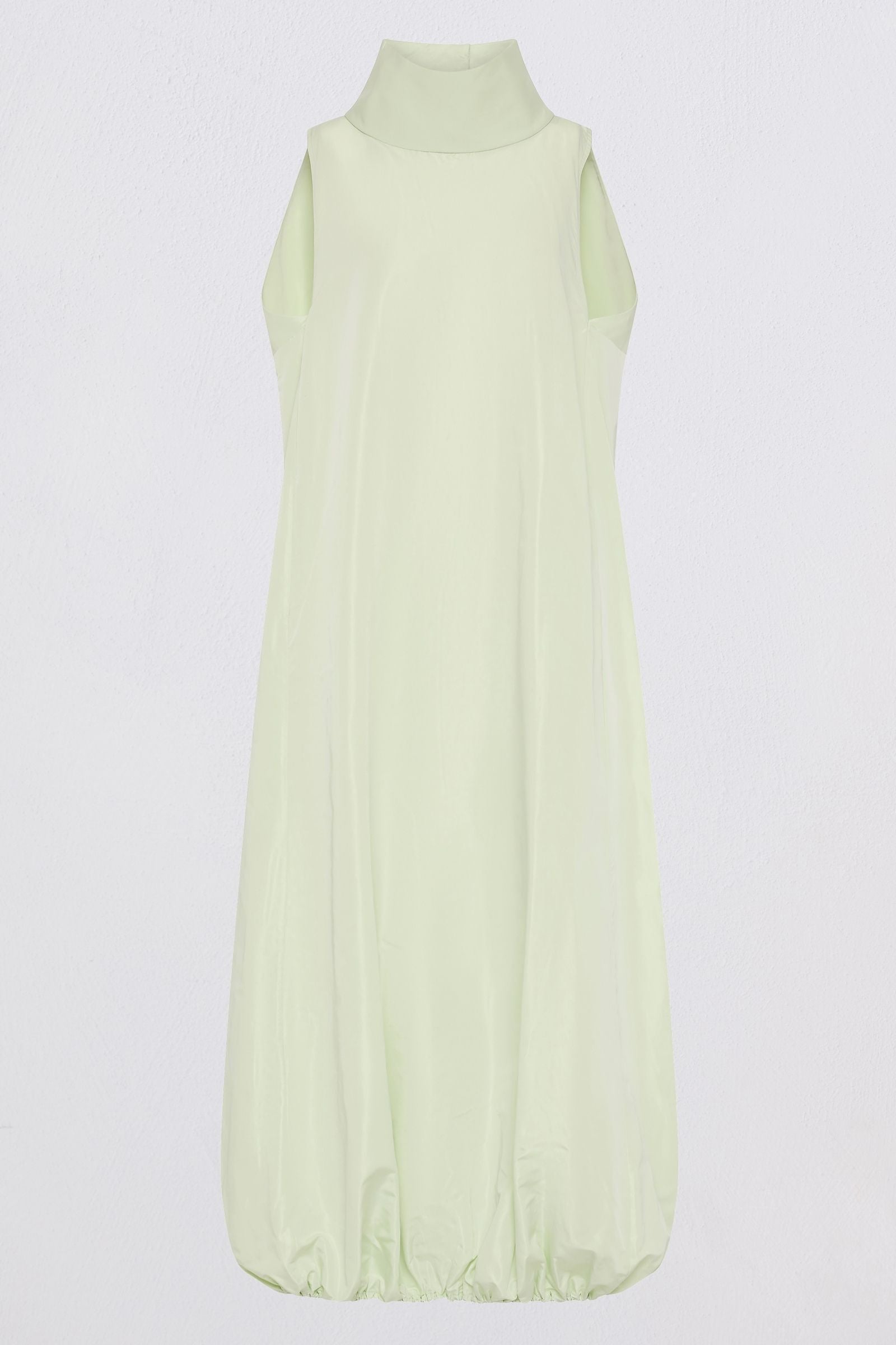A pale mint green sleeveless maxi dress with a mock neck and gathered balloon hem, shown against a plain light gray background.