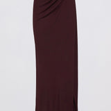 A dark burgundy wrap midi skirt with a draped waist and side slit, displayed on a clean white background.