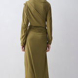 Woman wearing a green dress with a white background