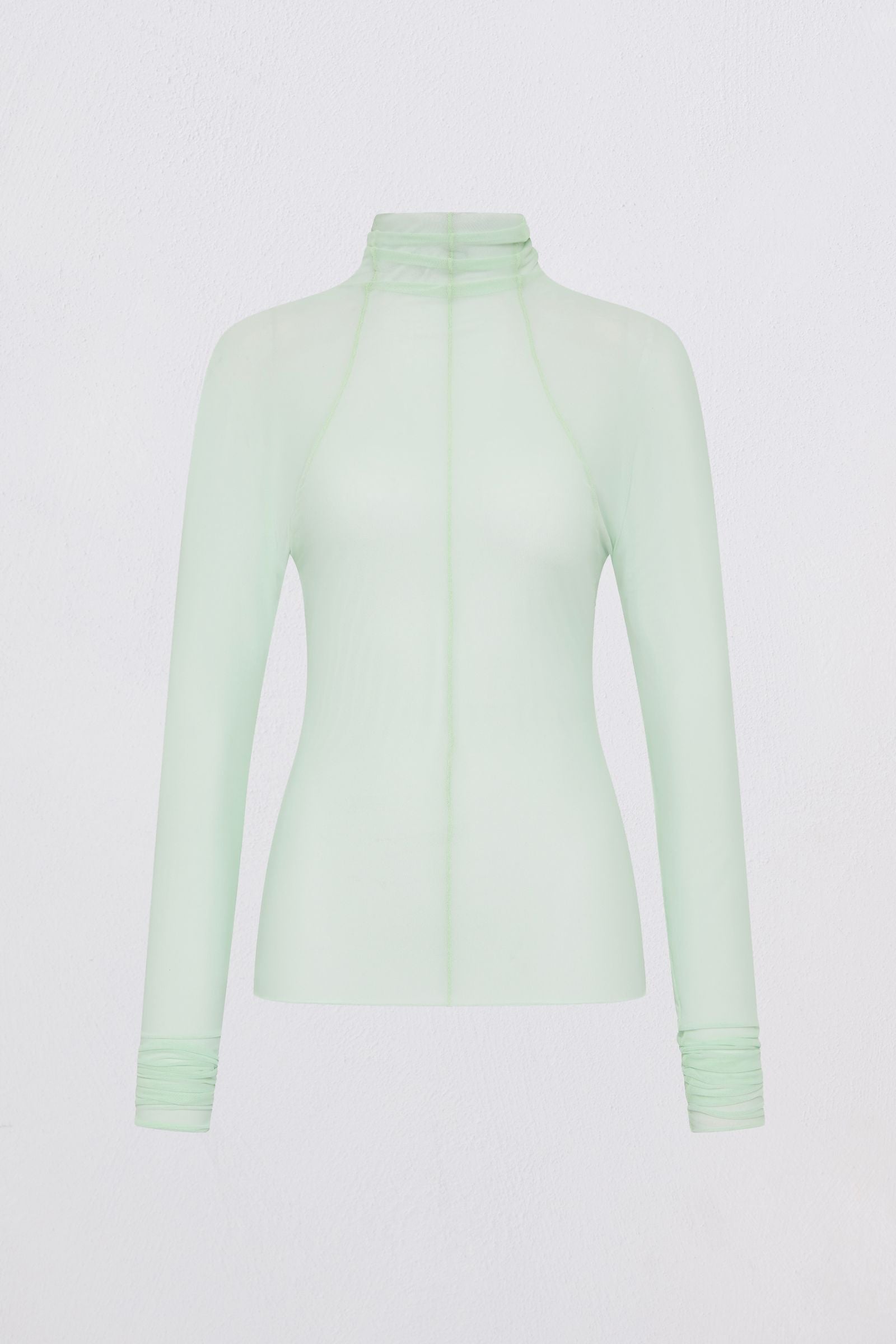 Light green long-sleeve top on a white background