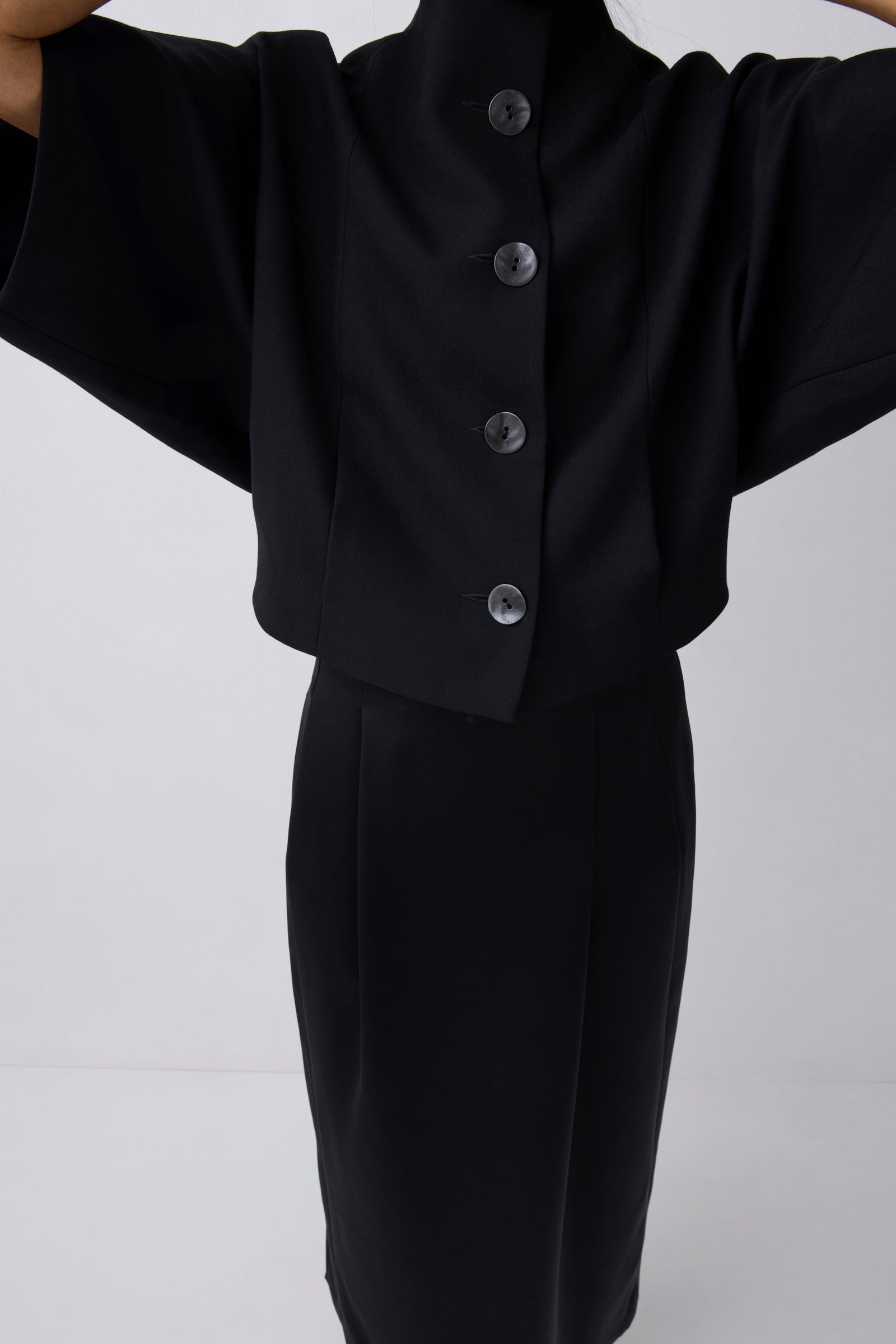 Black suit with buttons on a white background