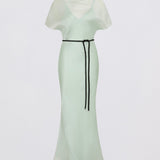 Light green dress with a black belt on a white background