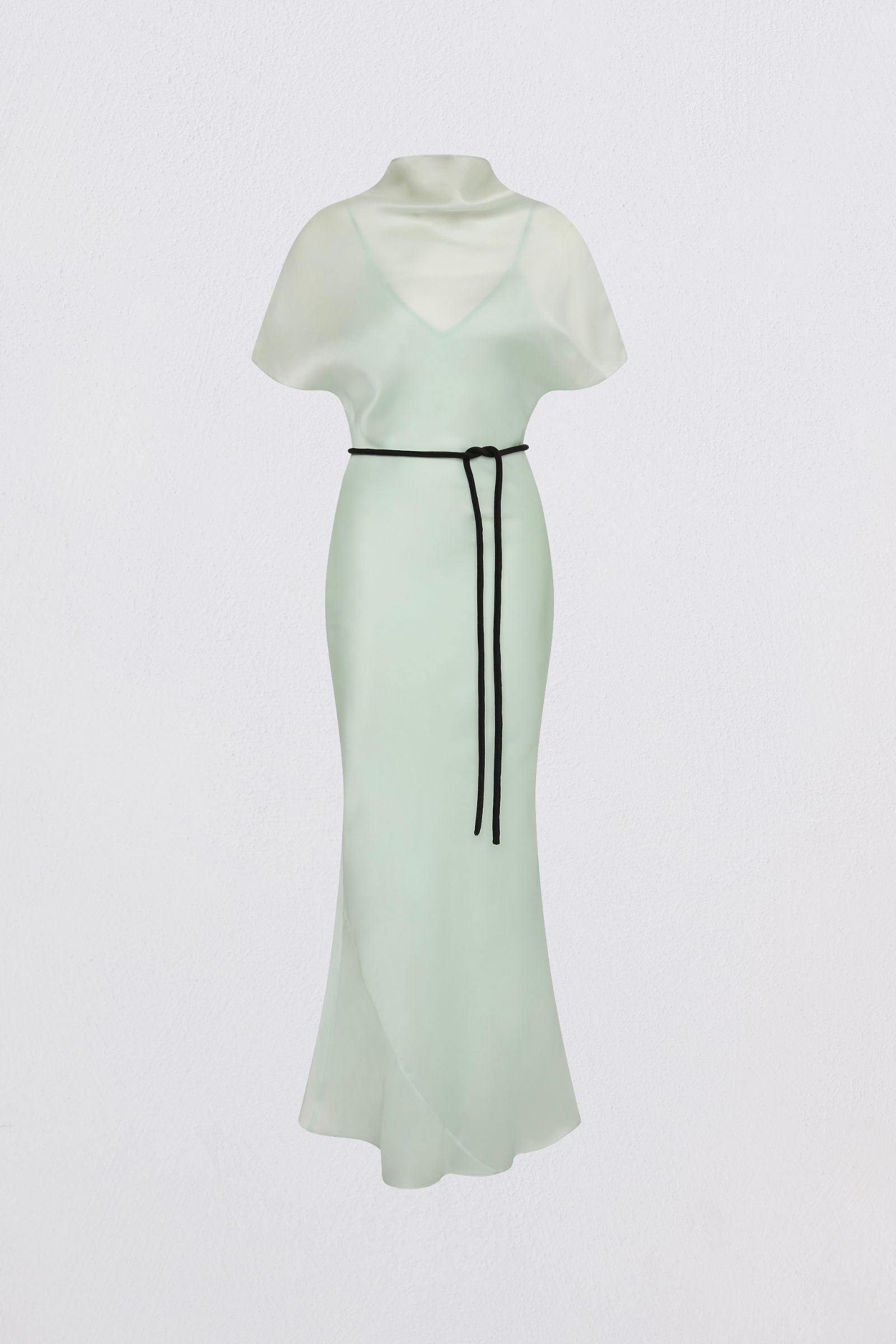 Light green dress with a black belt on a white background
