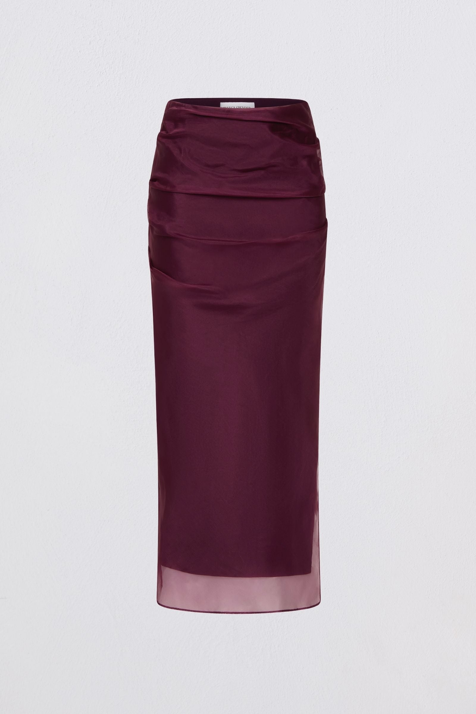 Purple skirt with a sheer overlay on a light gray background