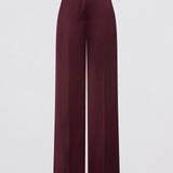 Maroon wide-leg pants on a light gray background