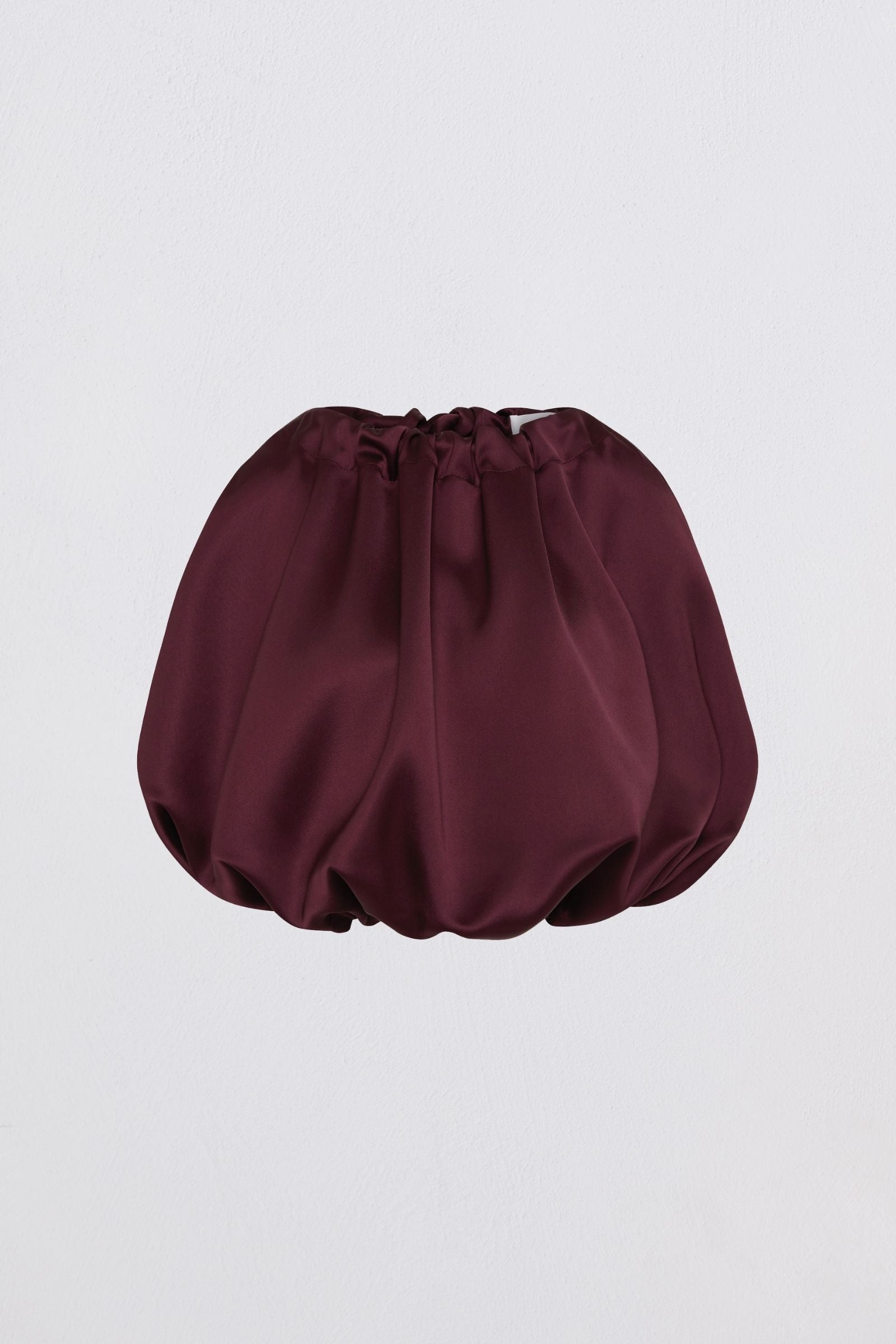 Purple top on light gray background