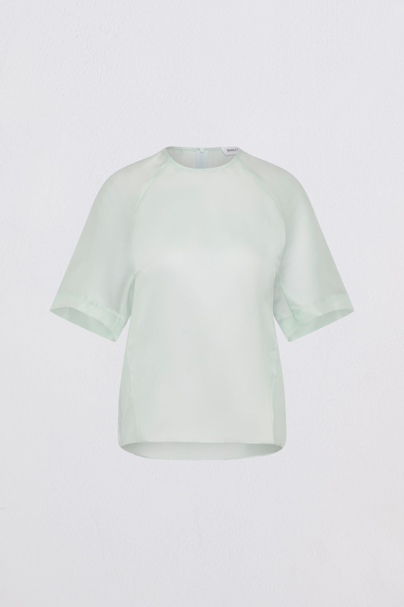 Light green t-shirt on a white background