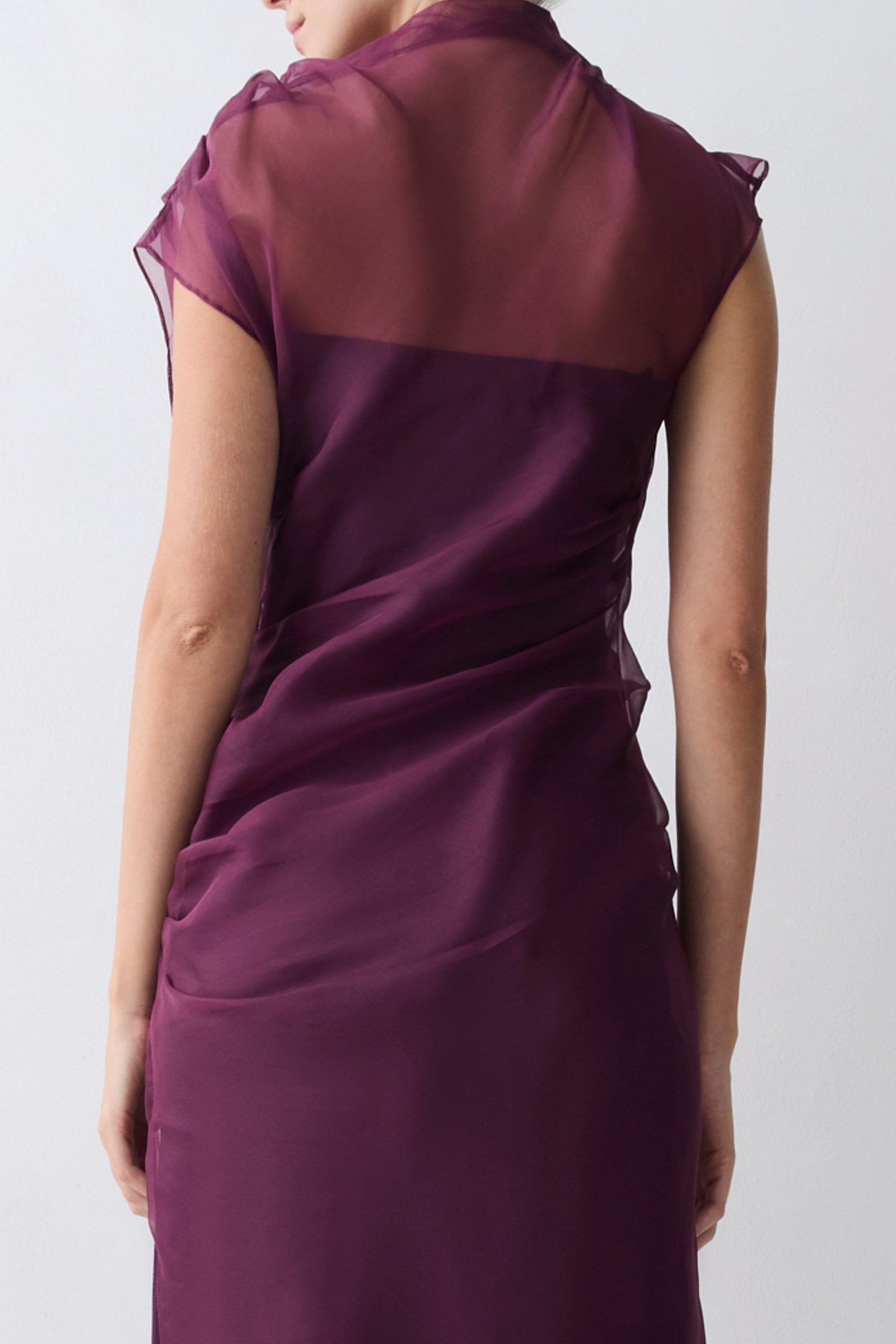Purple dress worn by a person on a white background