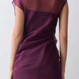 Purple dress worn by a person on a white background