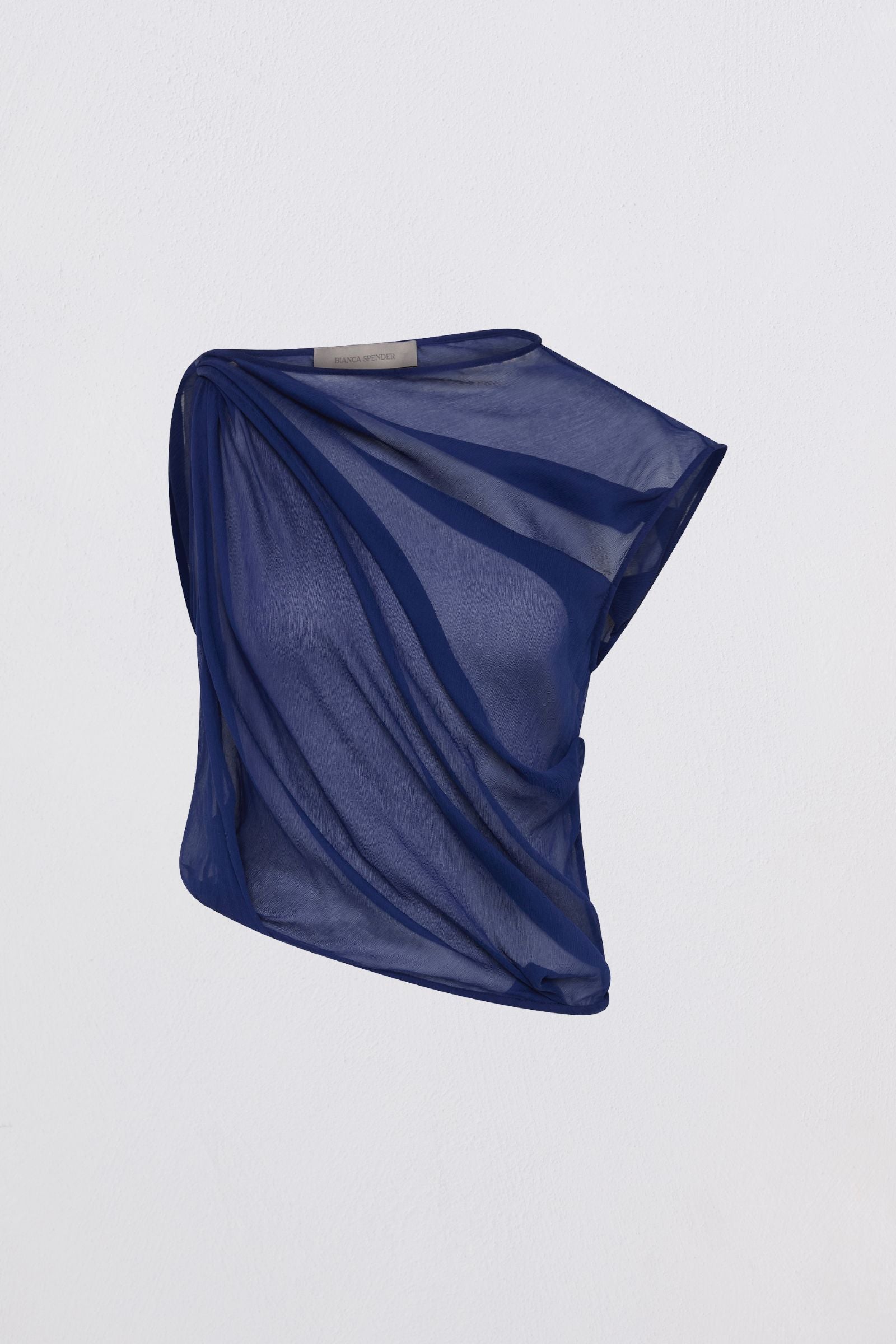 Blue draped fabric on a light gray background