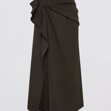 A dark brown draped wrap midi skirt with a large ruffle detail on the left side, shown against a plain light gray background.