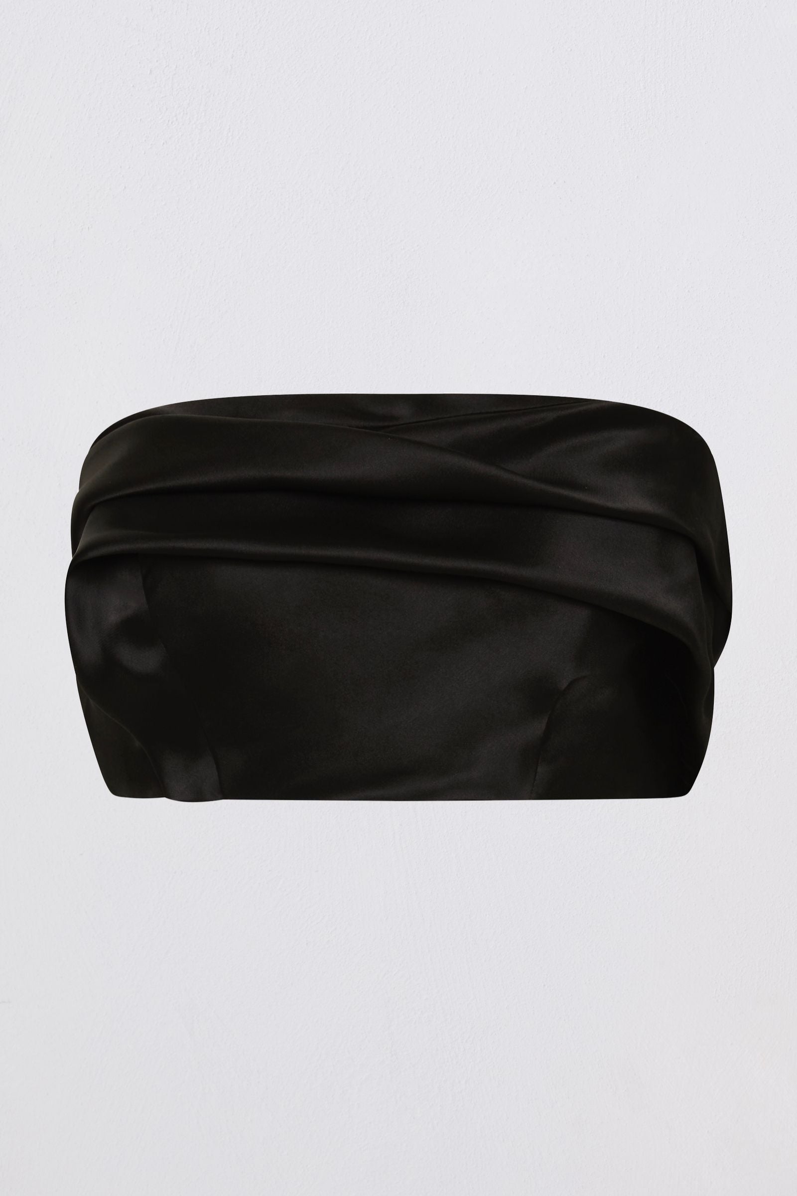A black satin or silk bustier top with a draped, gathered design, shown against a plain light gray background.