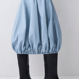 Light blue bubble skirt worn by a person on a white background